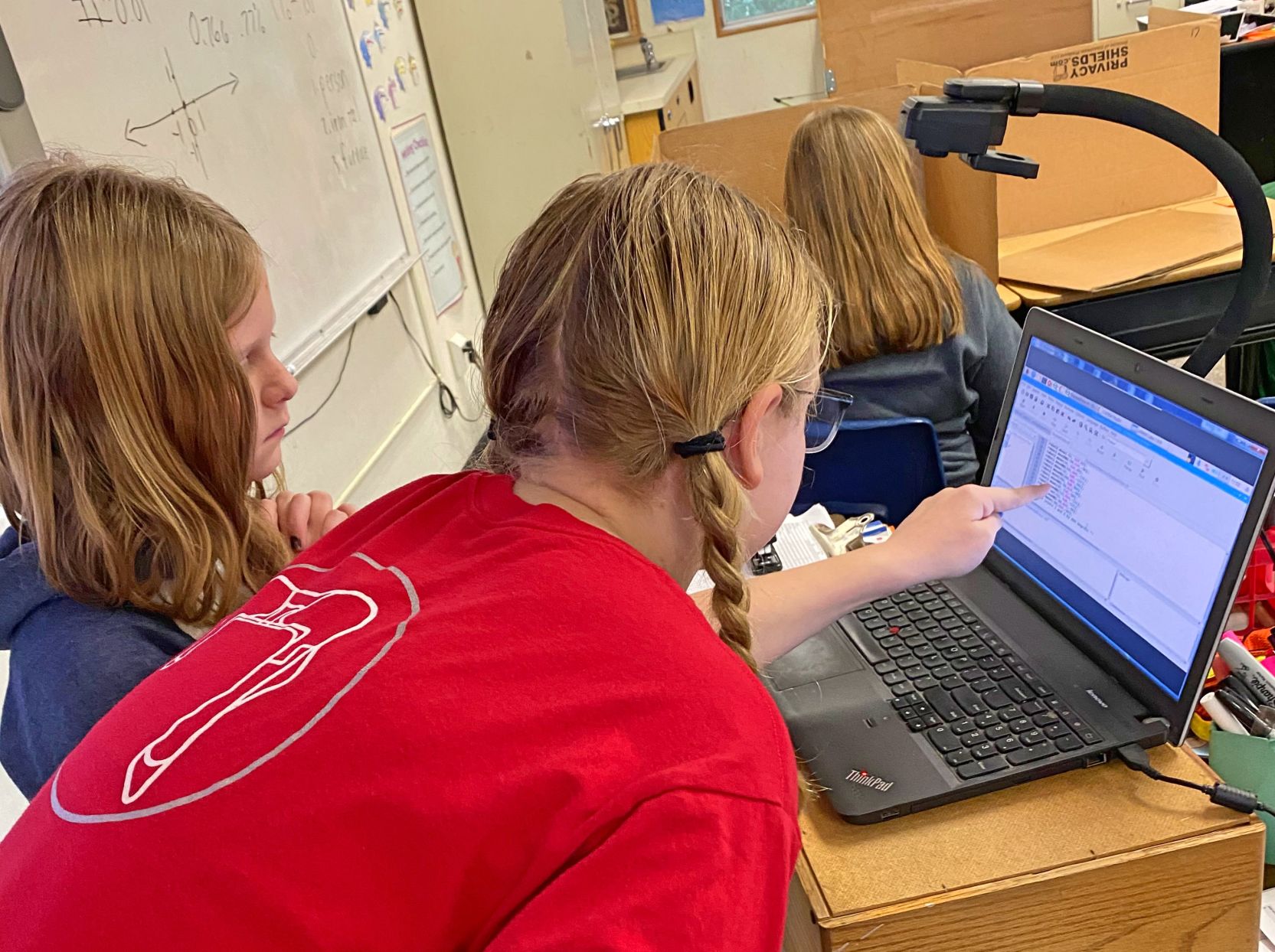 2. Parker March (left) and Audrey Kielb checking their code..jpg